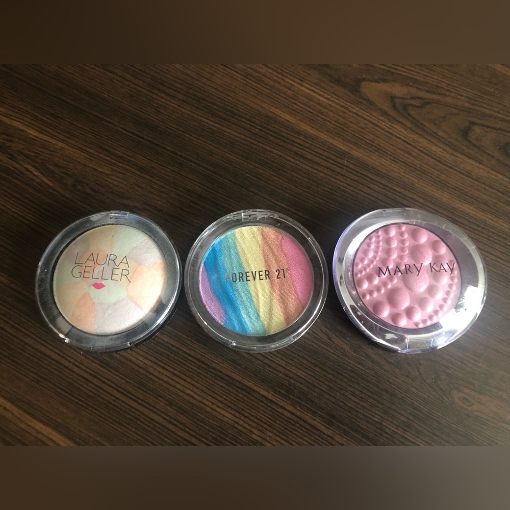 Three gently used Highlighters and Finishing Powder.
